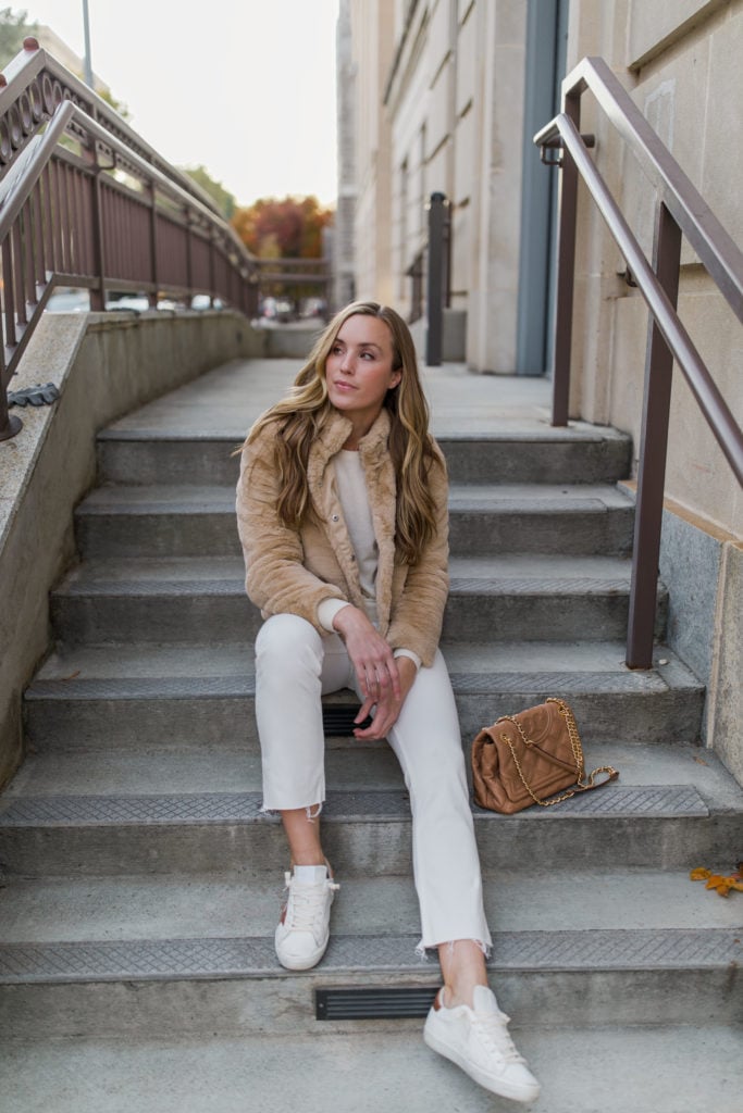 Tan Fuzzy Faux Fur Jacket with White Jeans and Sneakers — Neutral Winter Outfits