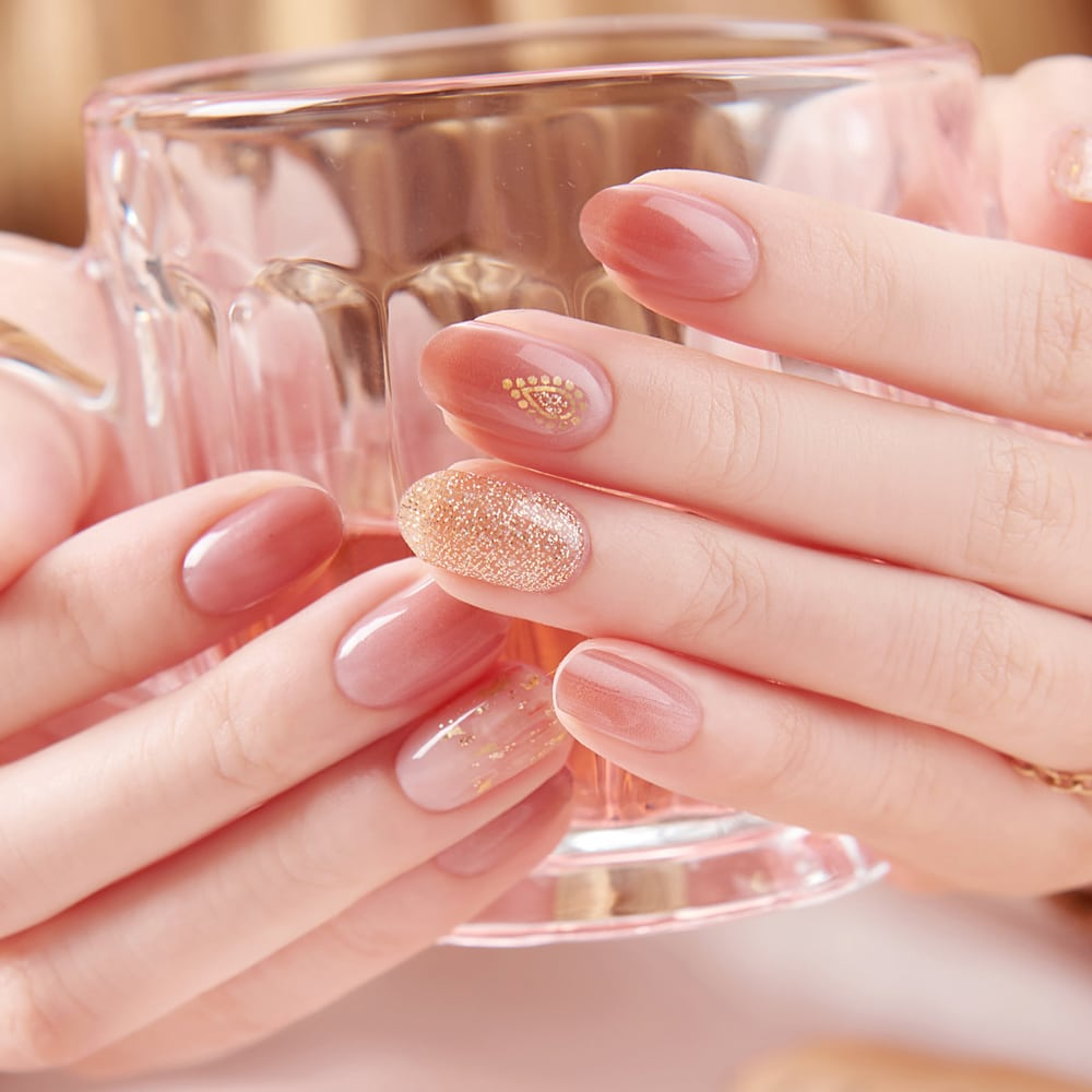Nude Pink with Gold Glitter and Embellishments — New Years Gel Nails 2027