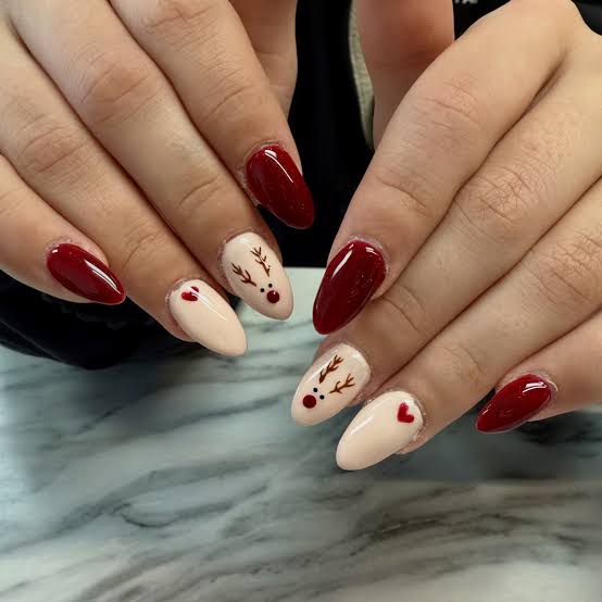 Deep Red with Sheer Nude Reindeer Outline Nails — Christmas Nails for Kids 2026