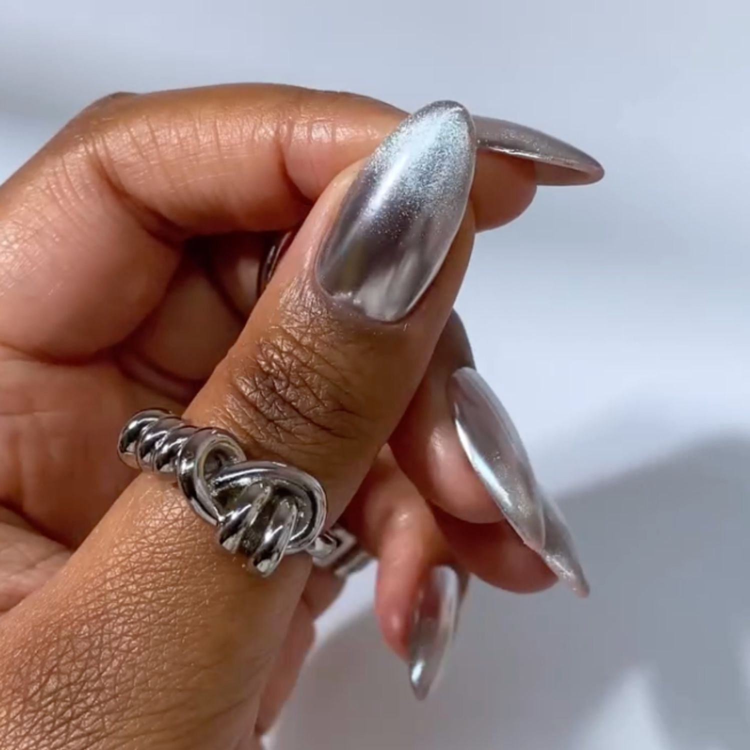 Shimmering Silver Cat-Eye Almond Nails Shimmering Silver Cat-Eye Almond Nails β New Years Eve Nails 2027