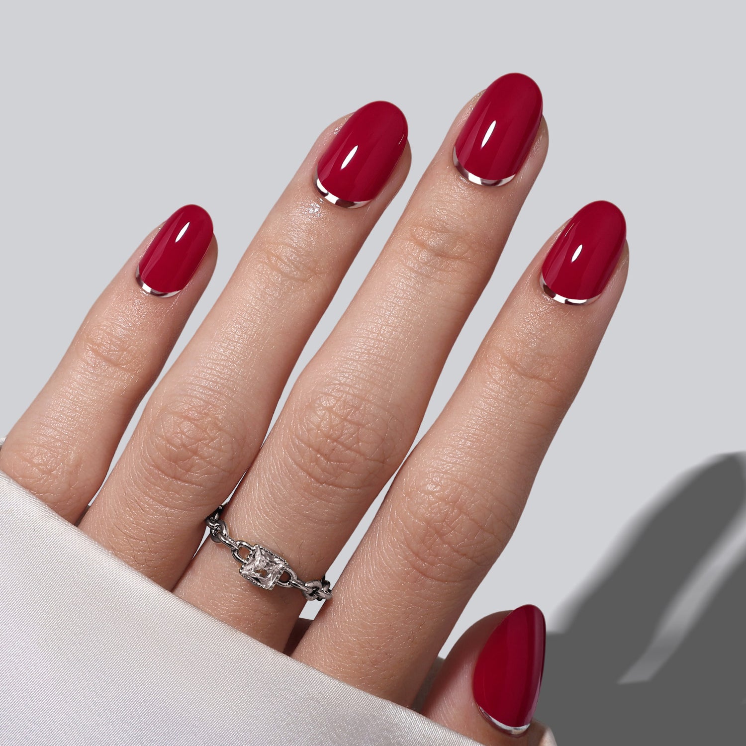 Deep Red with Metallic Silver Cuticle Line Deep Red with Metallic Silver Cuticle Line β Christmas Oval Nails 2026