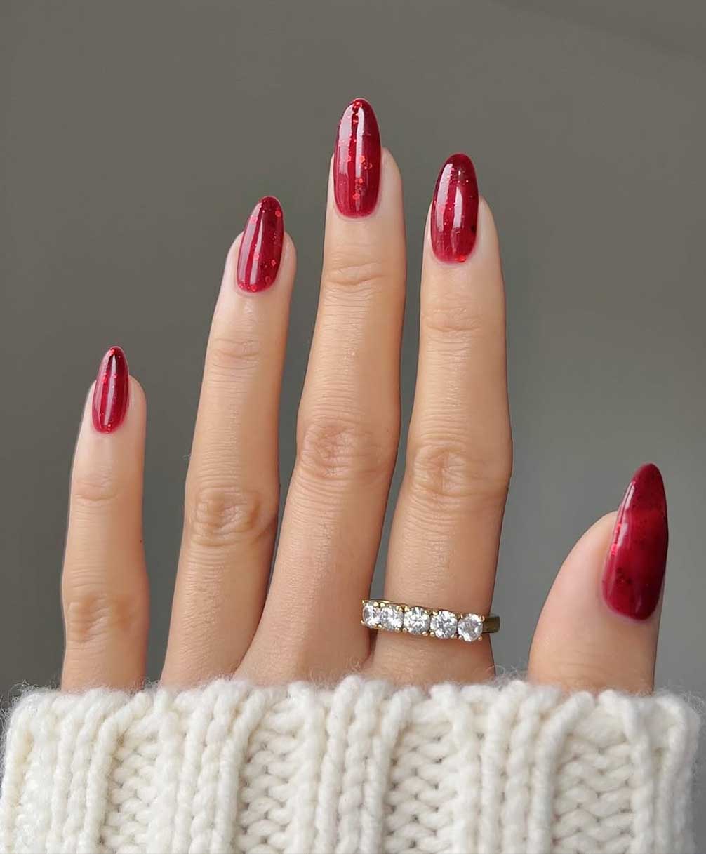 Deep Glossy Red Stiletto Nails with Subtle Sparkle — Red Christmas Nails 2026