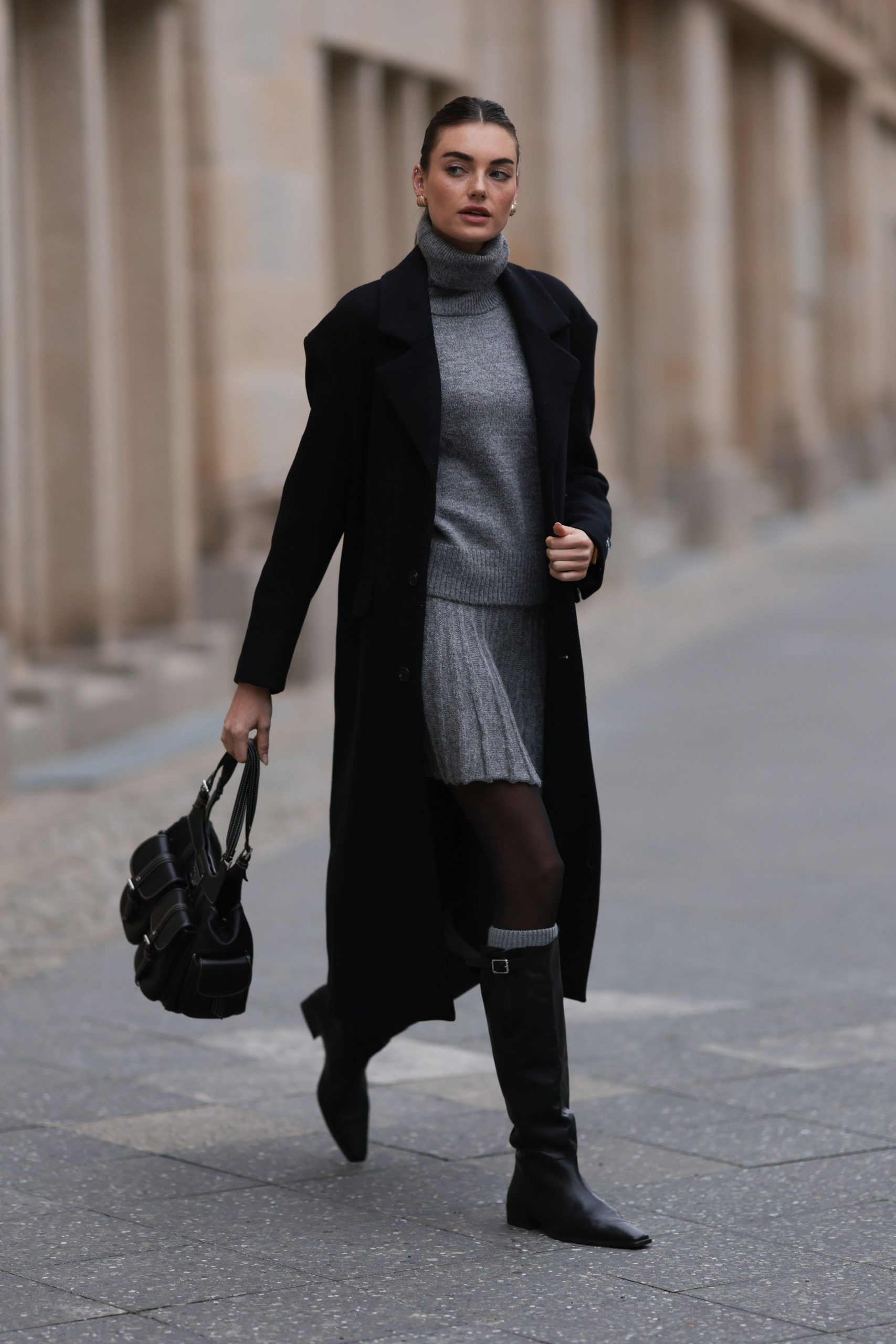 Monochromatic Grey and Black: Pleated Skirt with Knee-High Boots Monochromatic Grey and Black: Pleated Skirt with Knee-High Boots β Black Boots Outfits