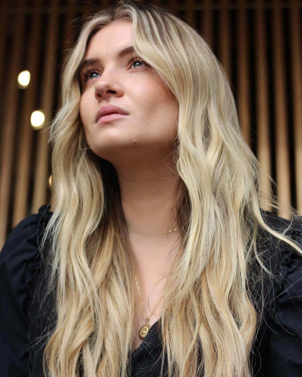 Mid-Back Ash Blonde Layered Cut — Winter Haircuts with Curtain Bangs