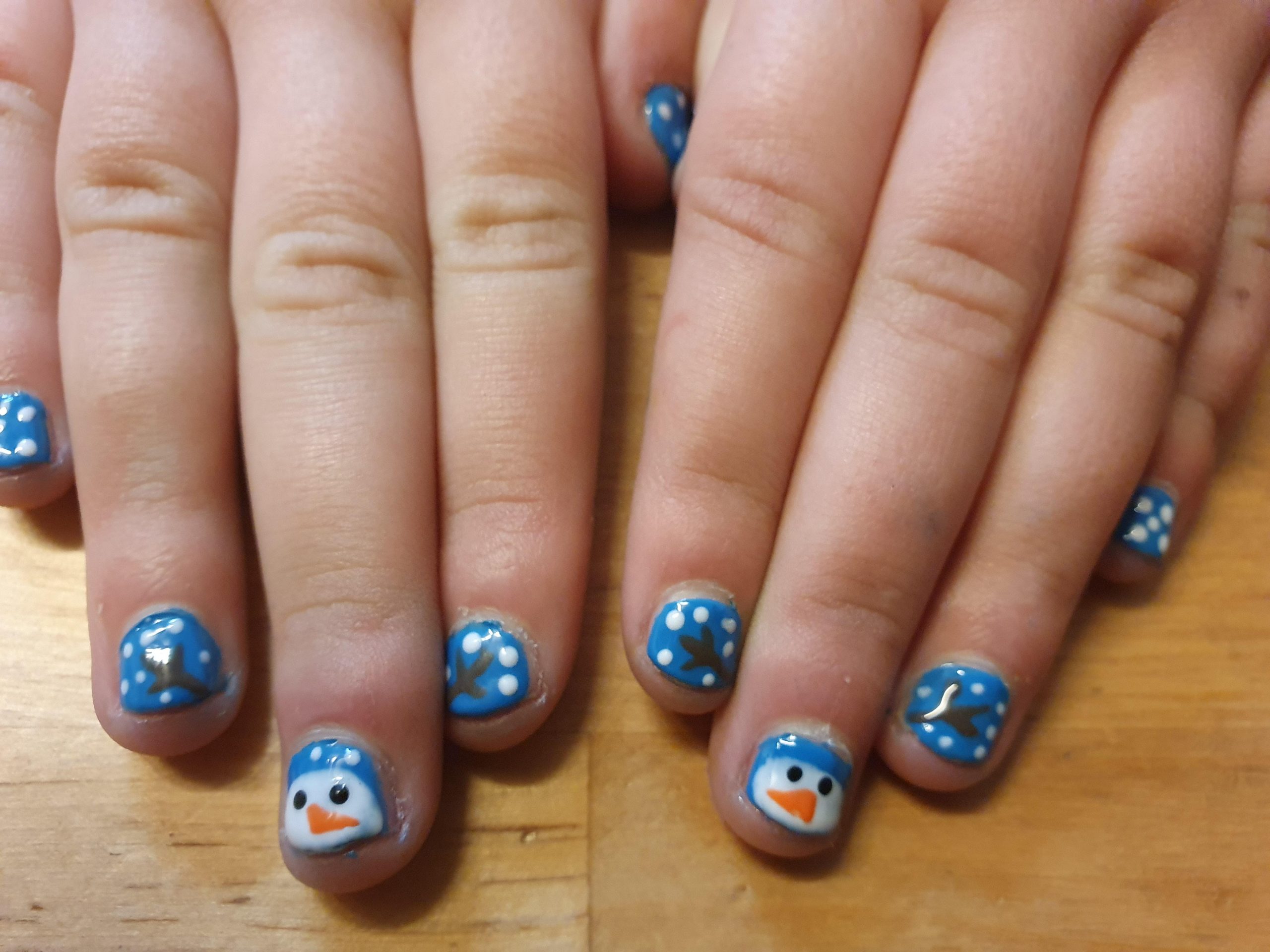 Blue with White Polka Dots and Snowman Faces — Christmas Nails for Kids 2026