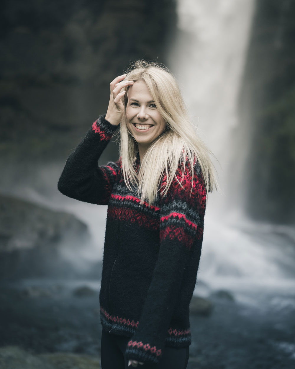 Black Zip-Up Cardigan With An Intricate Red And Grey Knit Pattern Black Zip-Up Cardigan With An Intricate Red And Grey Knit Pattern β Iceland Winter Outfits