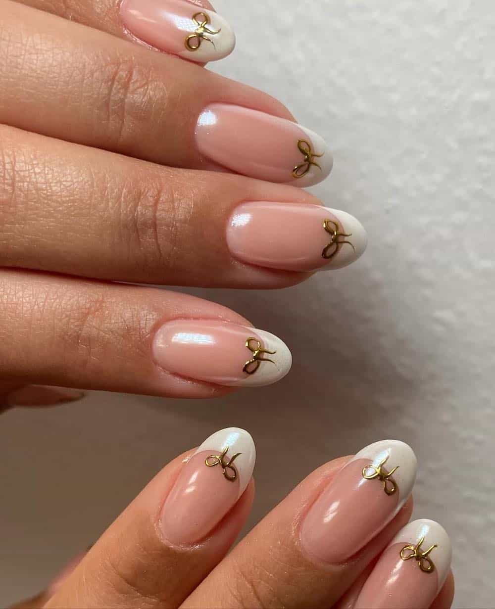 Short Oval French with Gold Bow Charms Short Oval French with Gold Bow Charms β Coquette Winter Nails