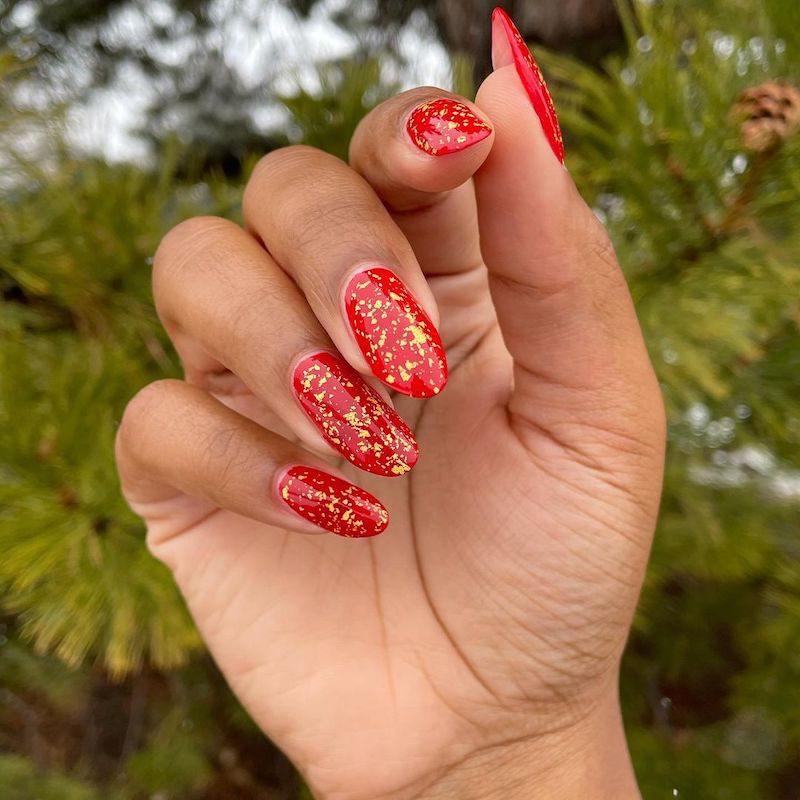 Vibrant Red with Scattered Gold Flakes Vibrant Red with Scattered Gold Flakes β Red and Gold Christmas Nails 2026