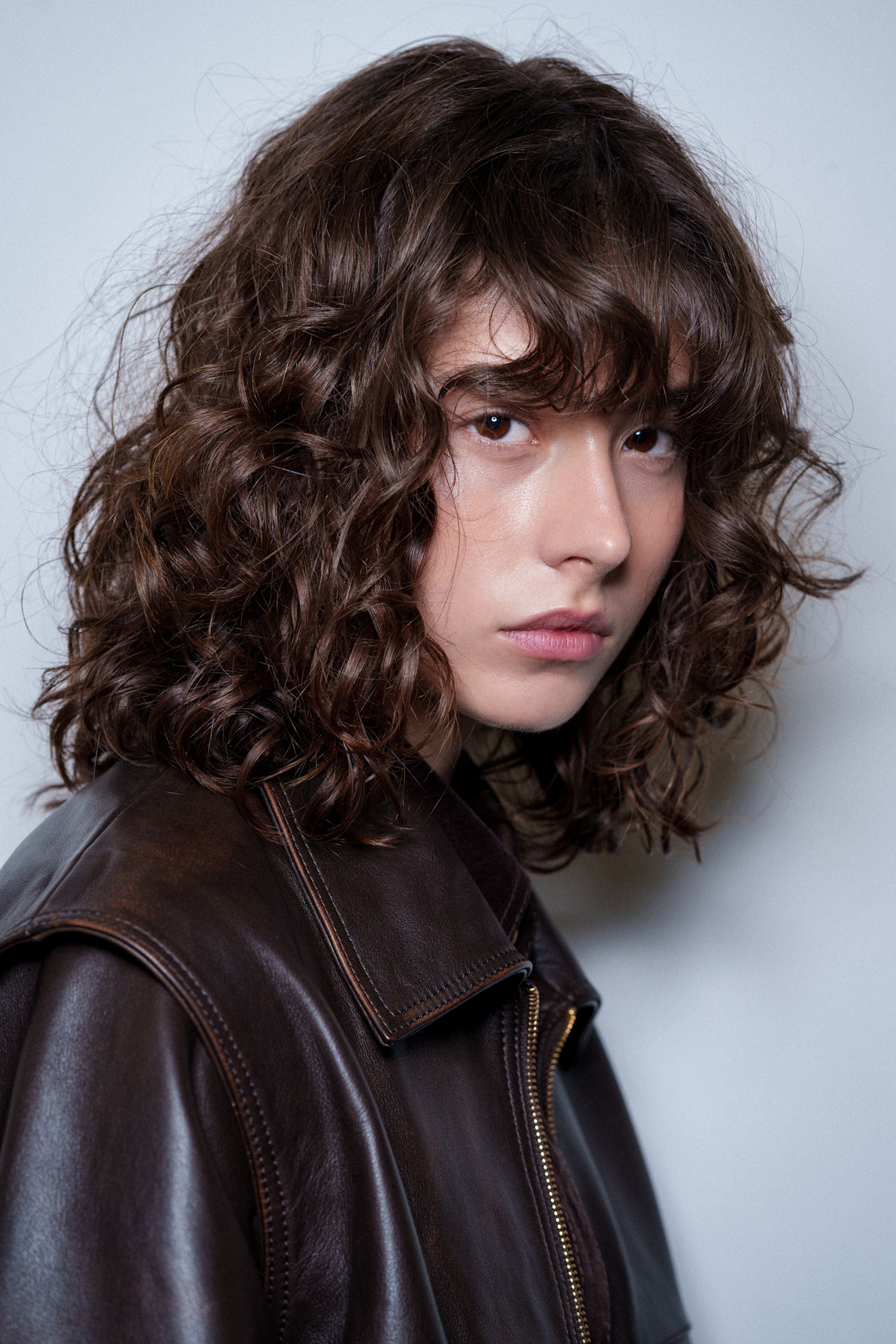 Collarbone Lob With Curly Bangs — Winter Haircuts for Curly Hair