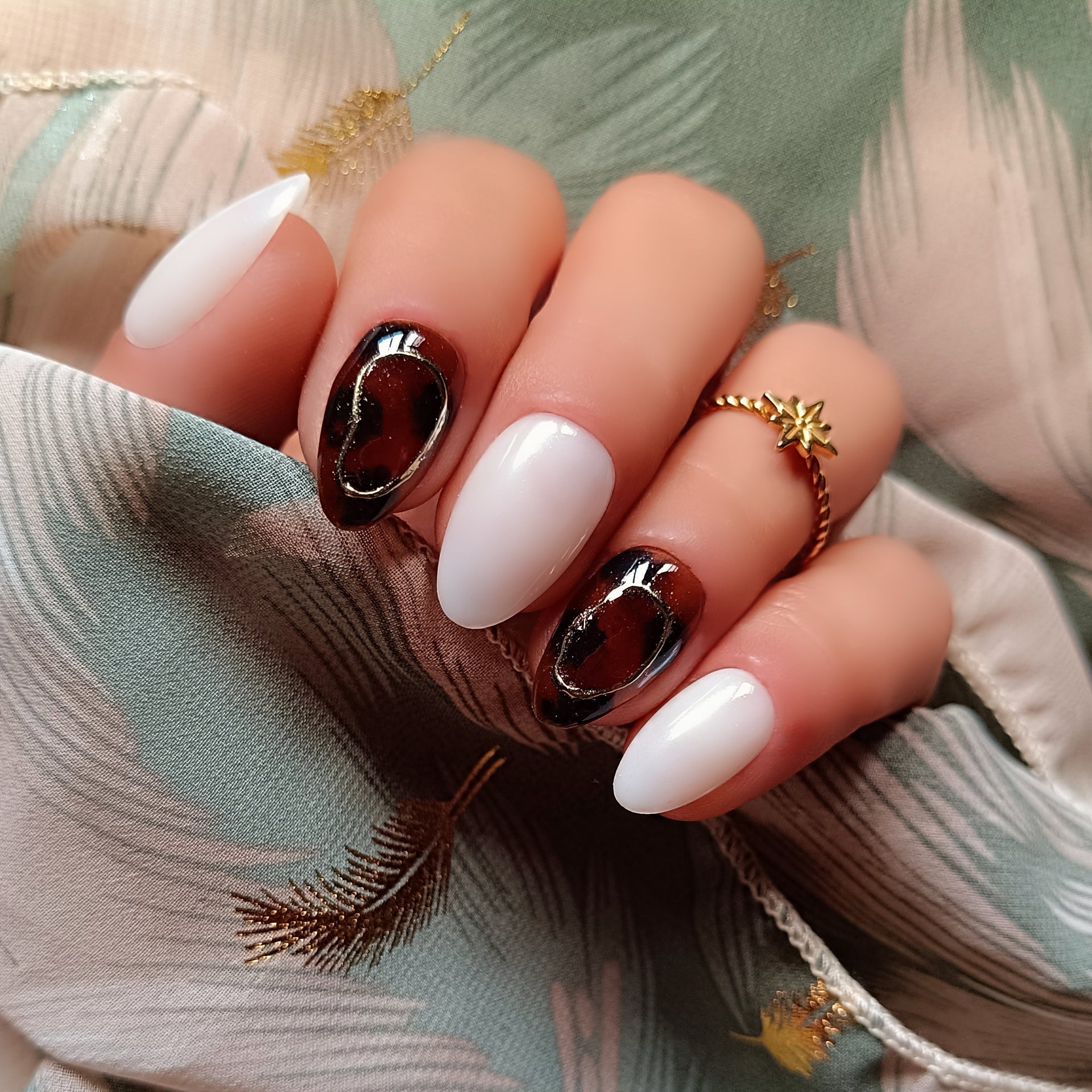 Tortoiseshell And White Winter Almond Nails Tortoiseshell And White Winter Almond Nails β Medium Winter Almond Nails