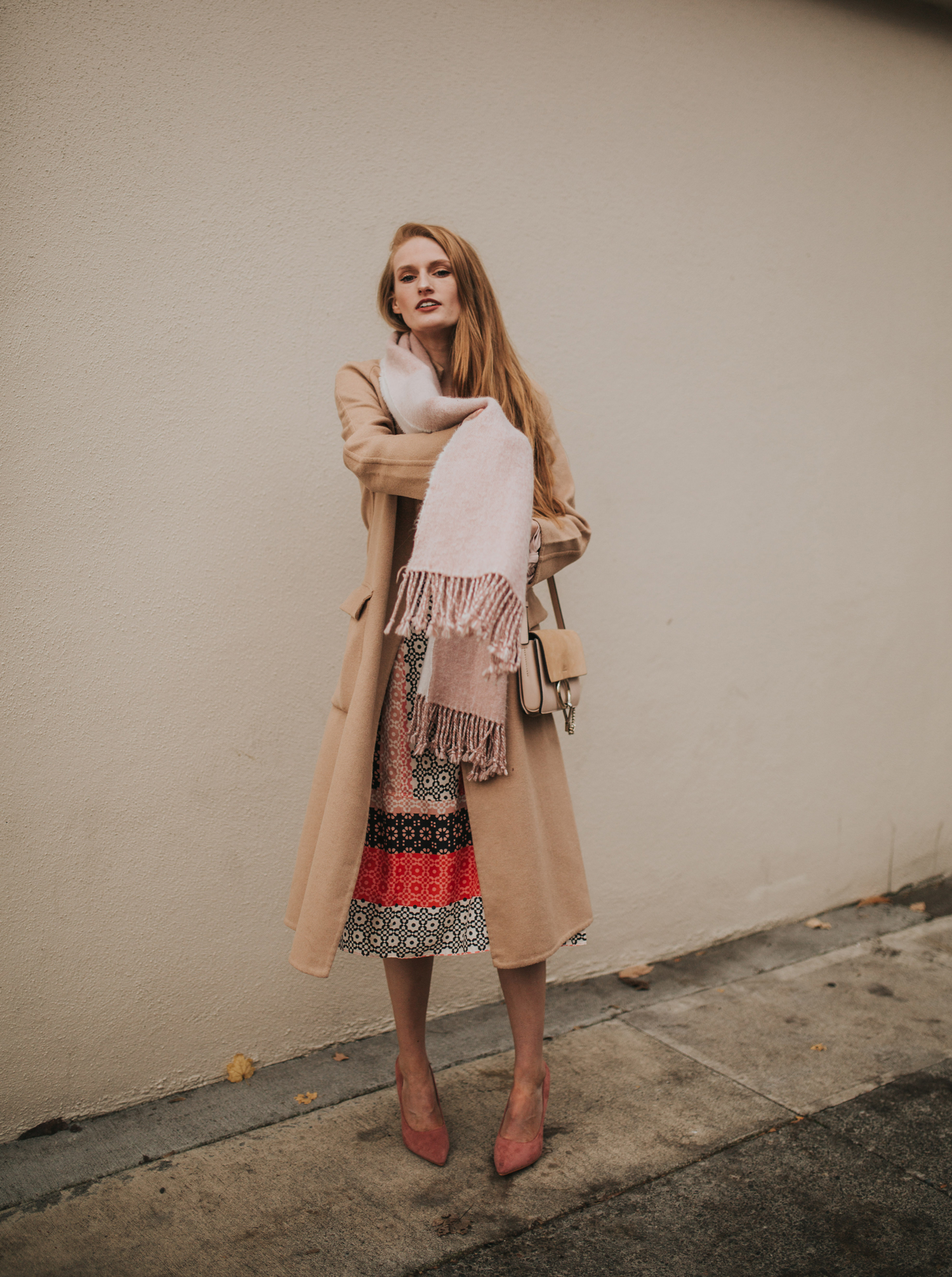 Camel Coat Over Printed Midi Dress And Pink Scarf — Camel Coat Outfits