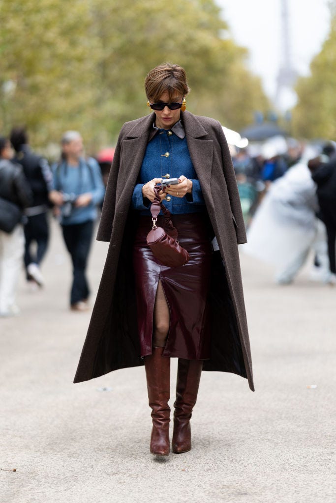 Sophisticated Ensemble: Wool Coat, Patent Skirt, and Brown Leather Boots — Winter Boots Outfits
