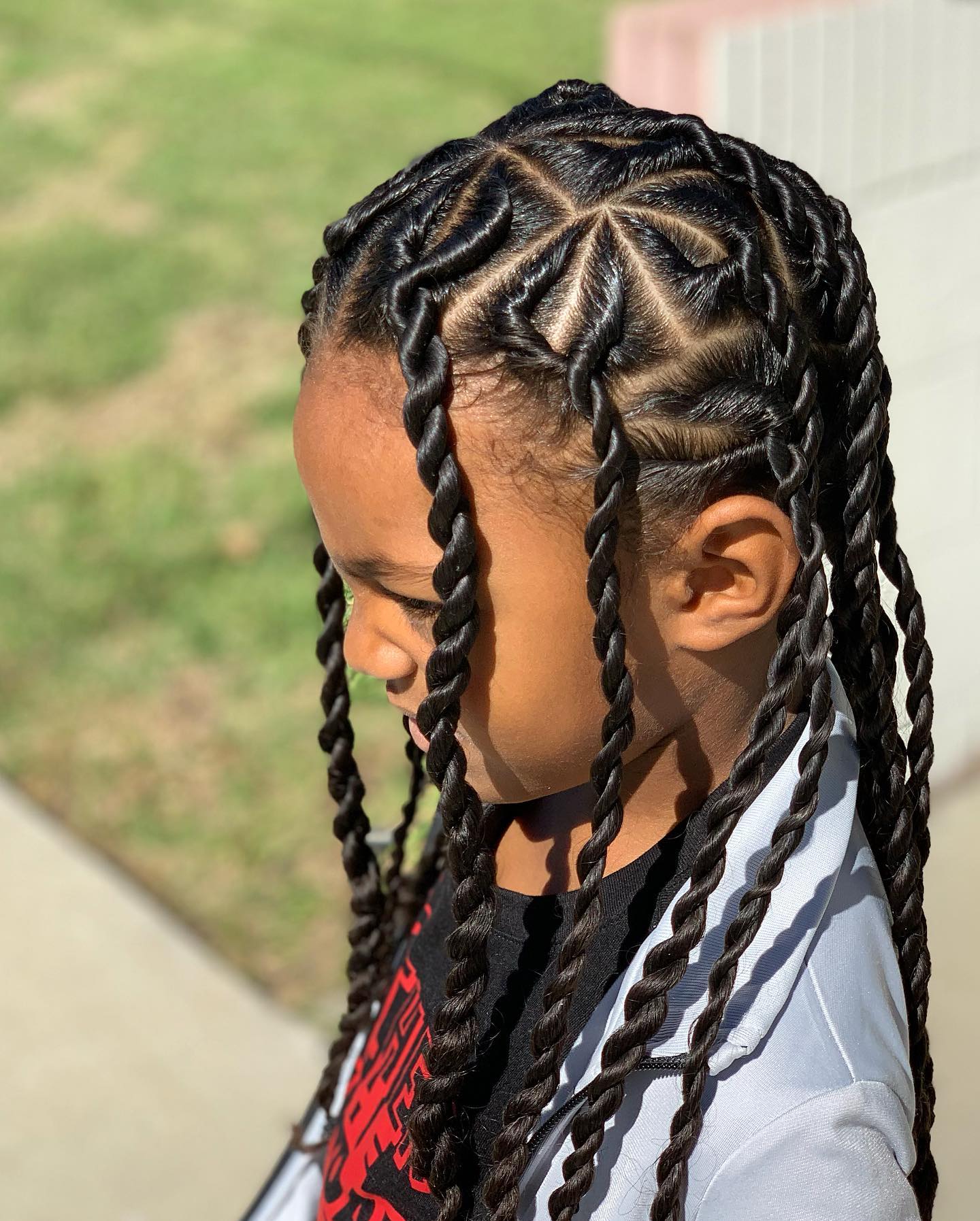 Geometric Parting With Long Twisted Braids Geometric Parting With Long Twisted Braids β Winter Hairstyles for Black Kids