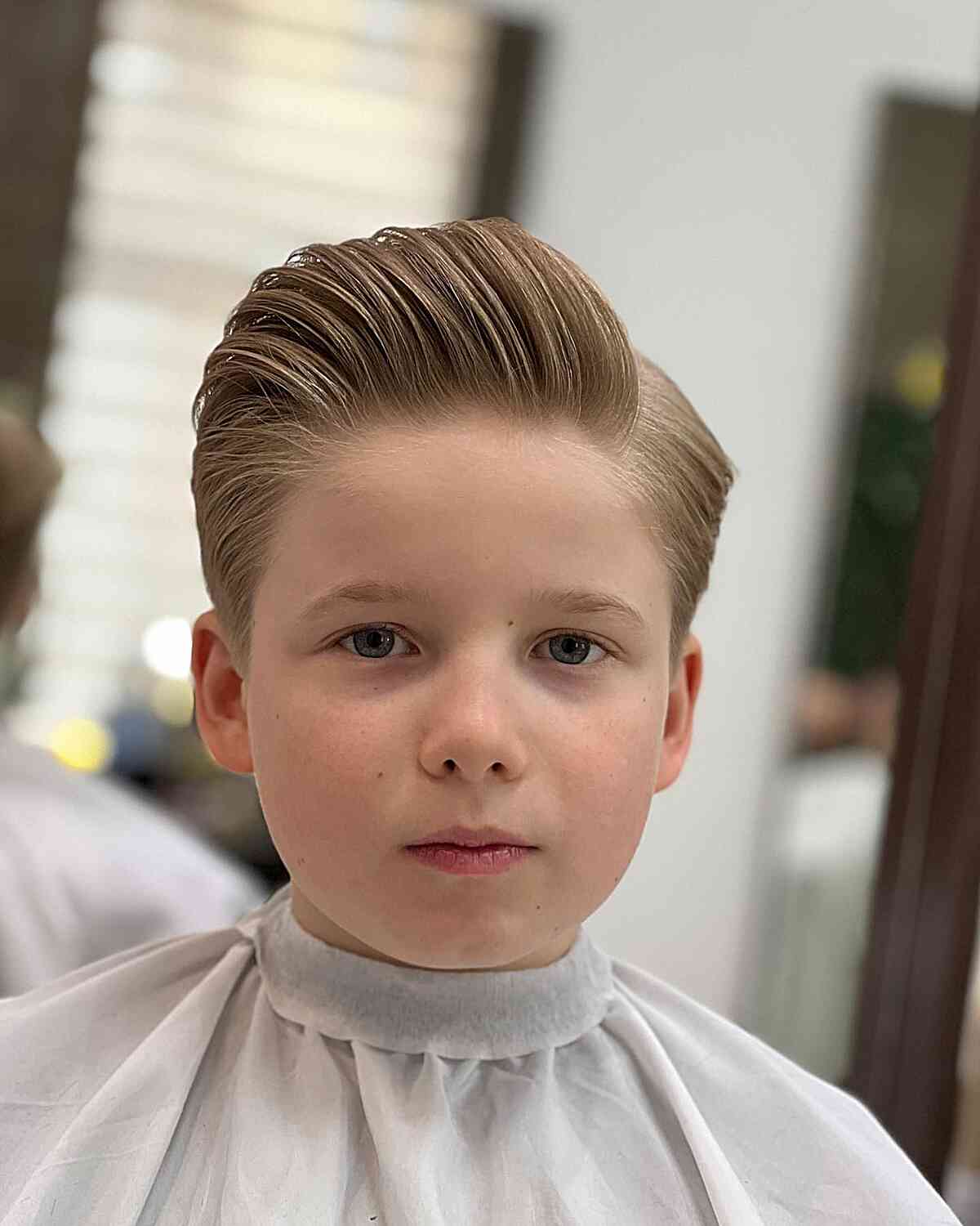 Slicked Back Volume With Side Part — Winter Haircuts for Boys