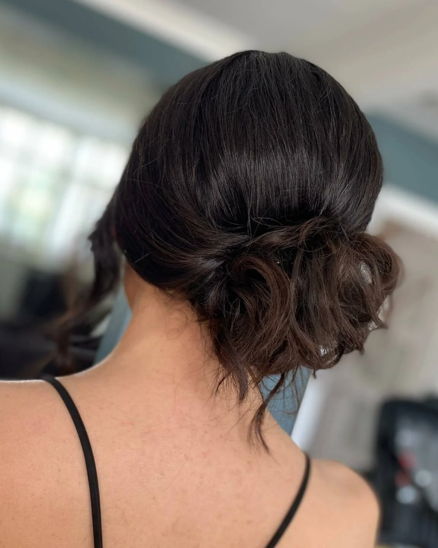 Low Messy Bun With Loose Tendrils Low Messy Bun With Loose Tendrils β Winter Formal Hairstyles