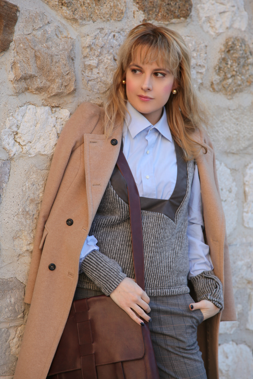 Camel Coat Draped Over Knit Vest — Brown Coat Outfits
