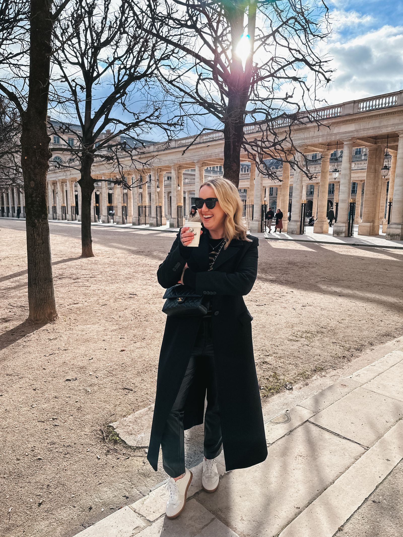 Long Black Wool Coat with White Sneakers for a Minimalist Brunch Long Black Wool Coat with White Sneakers for a Minimalist Brunch β Winter Brunch Outfits