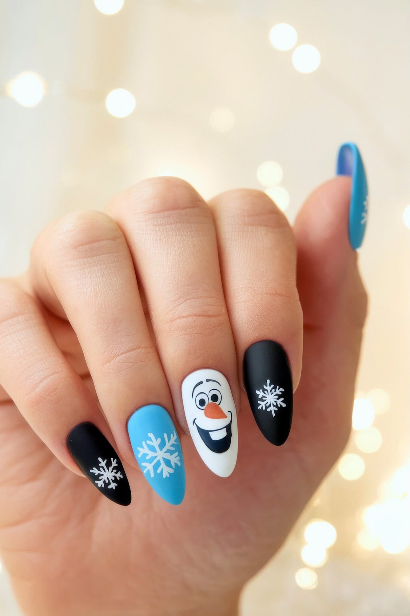 Olaf Blue and Black Matte Almond Nails Olaf Blue and Black Matte Almond Nails β Disney Christmas Nails 2026