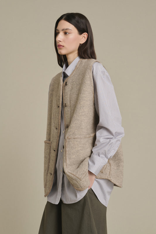 Oversized Knit Vest Over Striped Shirt with Wide-Leg Pants — Chicago Winter Outfits