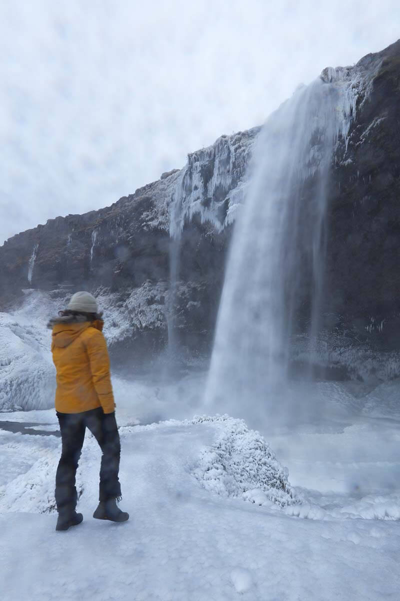 Bright Yellow Hooded Parka Paired With A Light Grey Beanie Bright Yellow Hooded Parka Paired With A Light Grey Beanie β Iceland Winter Outfits