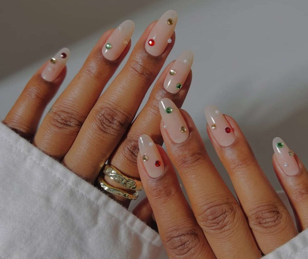 Sheer Nude with Scattered Holiday Rhinestones Sheer Nude with Scattered Holiday Rhinestones β Christmas Gel X Nails 2026