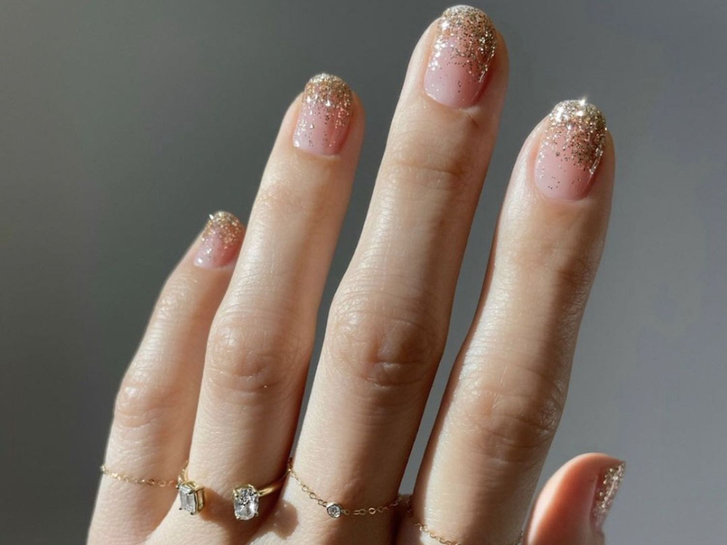 Short Oval Gold Glitter Gradient Tips — Minimalist New Years Nails 2027