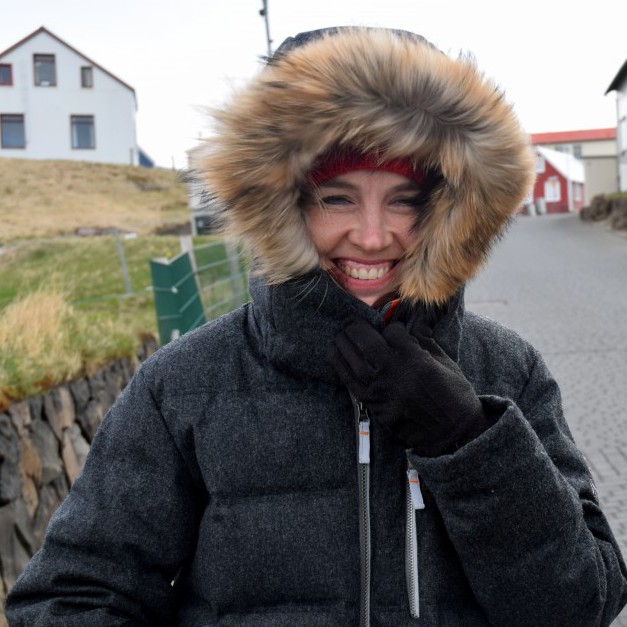 Dark Grey Puffer Jacket With Fur-Lined Hood And A Red Beanie Dark Grey Puffer Jacket With Fur-Lined Hood And A Red Beanie β Iceland Winter Outfits