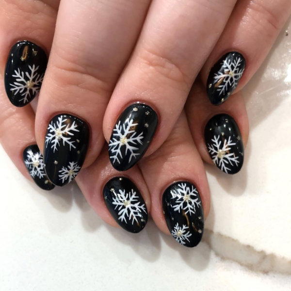 Glossy Black with Detailed Snowflakes and Gold Glitter — Winter Black Nails