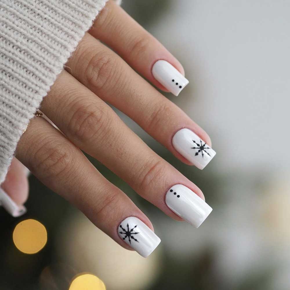 Glossy White Square Nails with Black Graphic Snowflakes Glossy White Square Nails with Black Graphic Snowflakes β Snowflake Nails