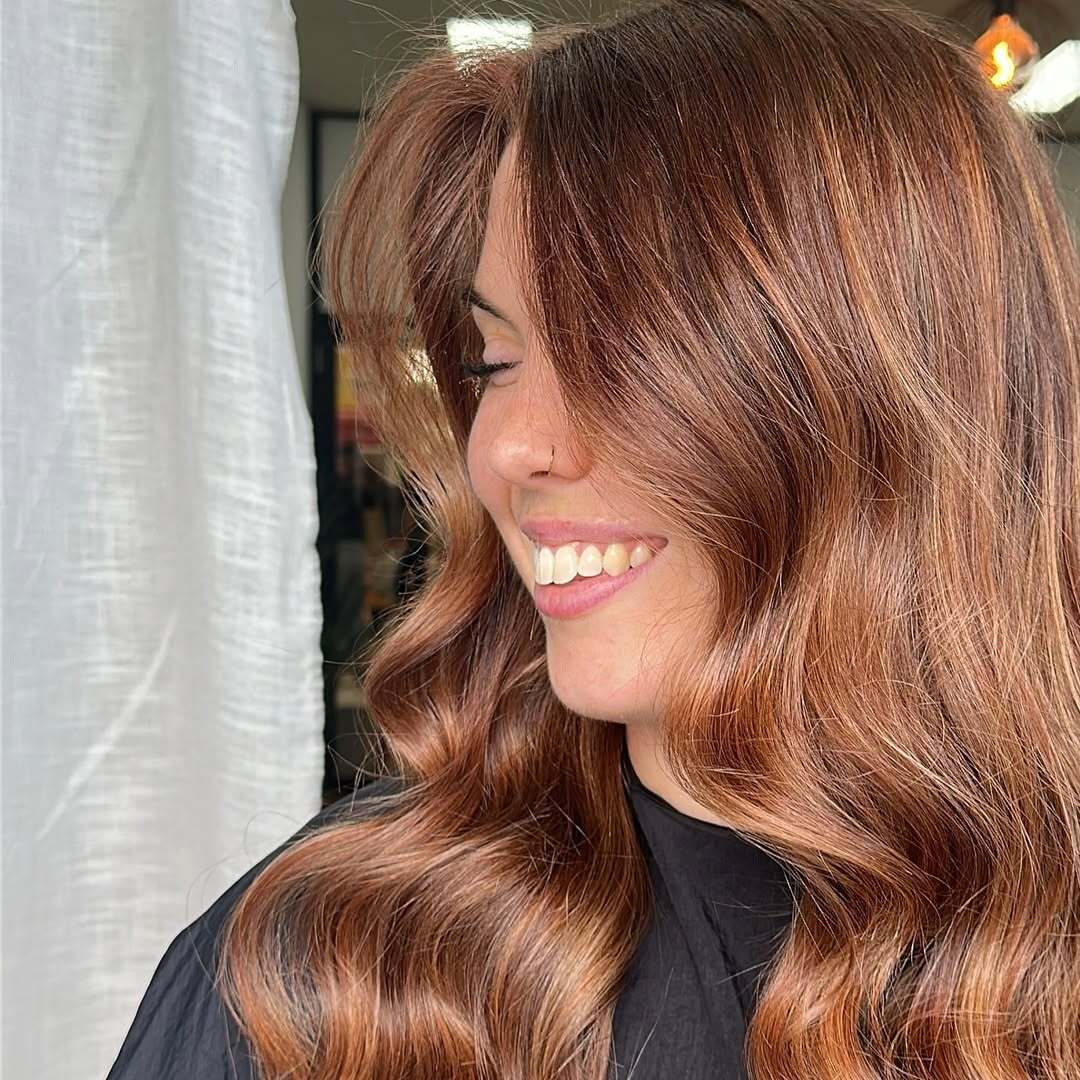 Long Copper Waves With Side-Swept Fringe Long Copper Waves With Side-Swept Fringe β Winter Natural Hairstyles