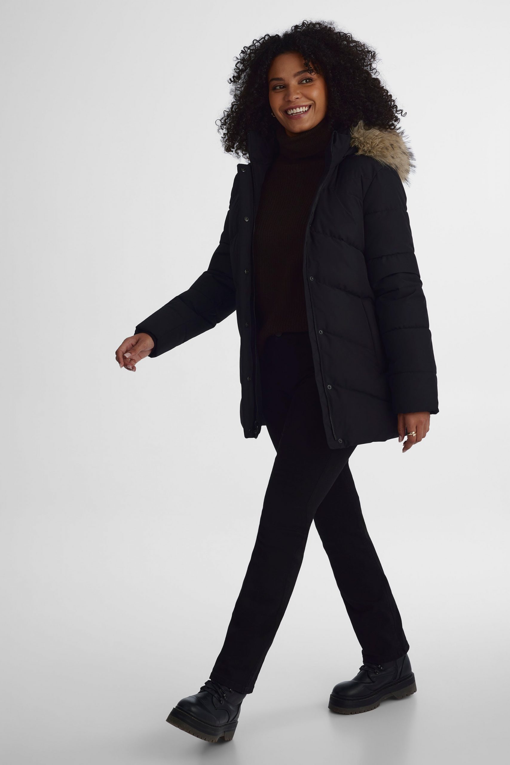 Fitted Black Puffer Jacket Over Turtleneck for a Sleek Winter Look — Winter Jackets for Women