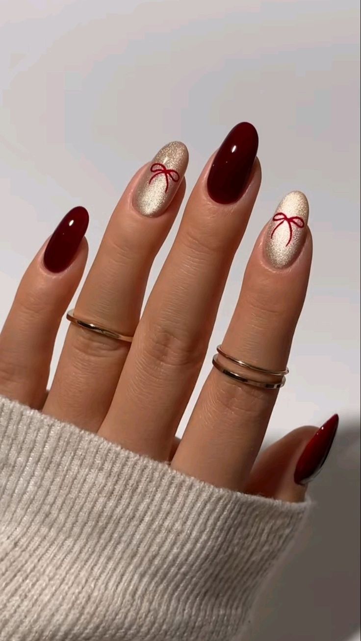 Burgundy and Champagne Gold with Red Bows — Winter Date Night Nails