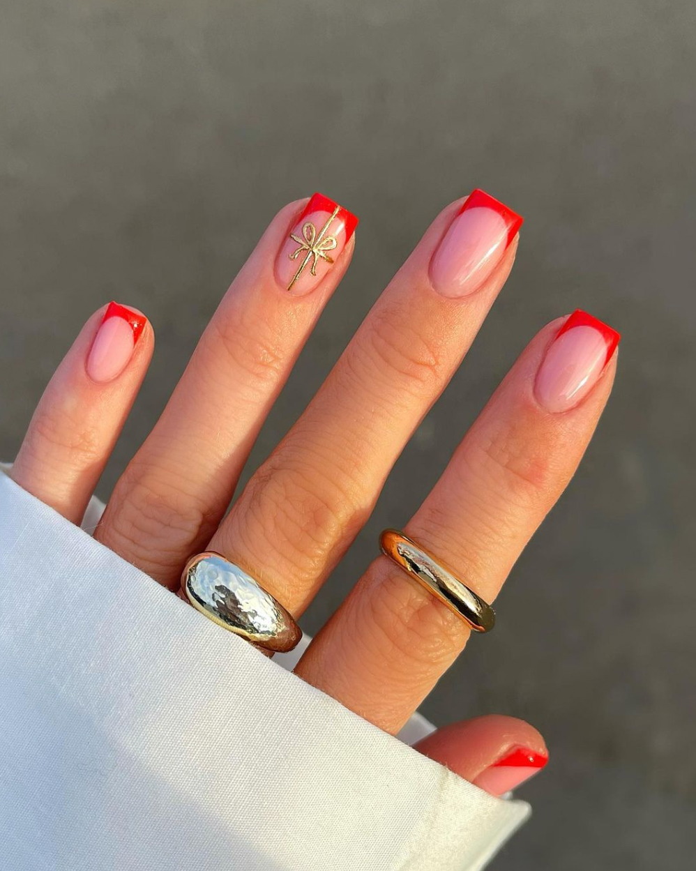 Sheer Pink Base With Red French Tips Sheer Pink Base With Red French Tips β Winter Nail Colors for Women Over 40