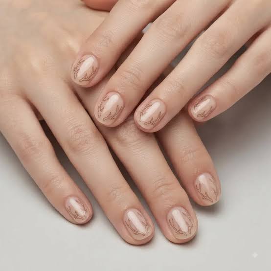 Nude Reindeer Antler Oval Nails Nude Reindeer Antler Oval Nails β Simple Short Christmas Nails 2026