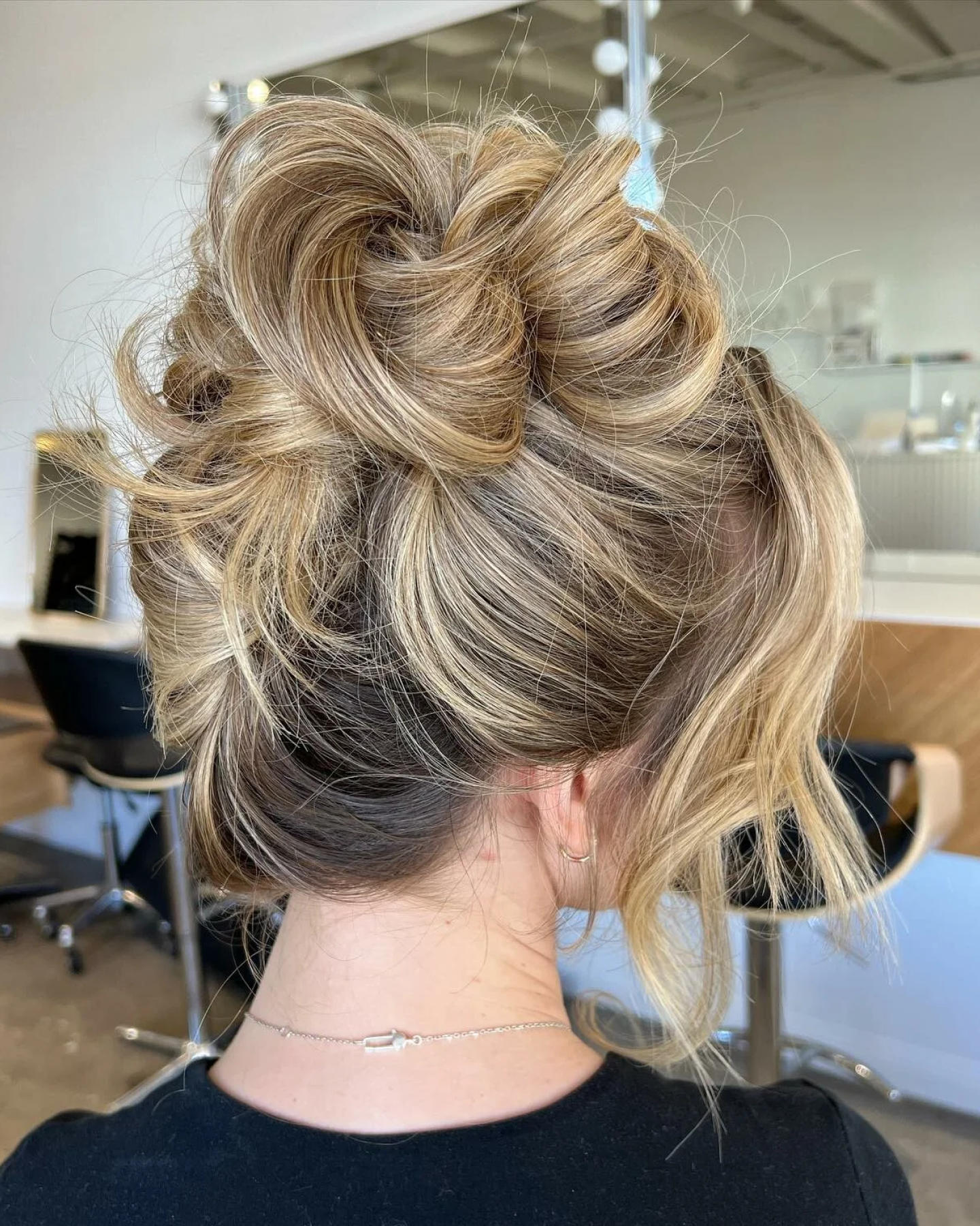 Neat Low Bun With Blonde Highlights — Winter Hairstyles for Work