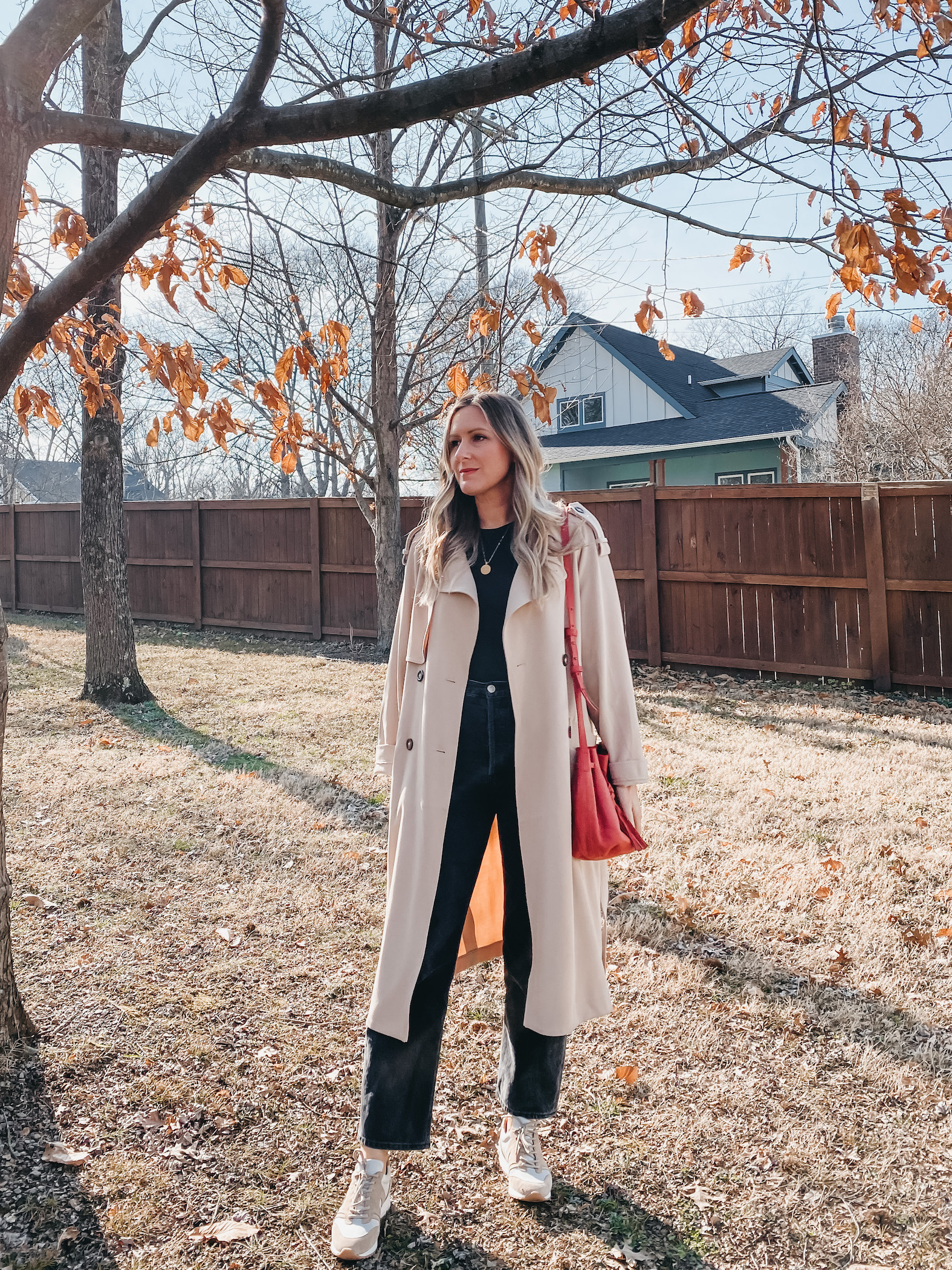 Beige Trench Coat Over Black Base with White Sneakers — Neutral Winter Outfits
