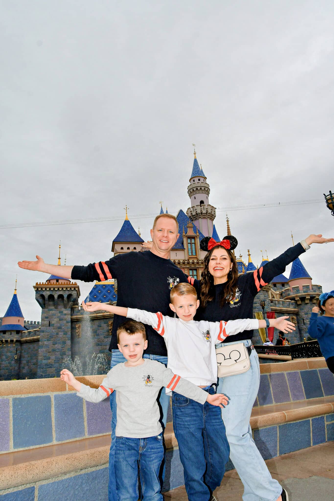 Disney Graphic Tee with Red Cardigan for a Theme Park Day Disney Graphic Tee with Red Cardigan for a Theme Park Day β Disney Winter Outfits