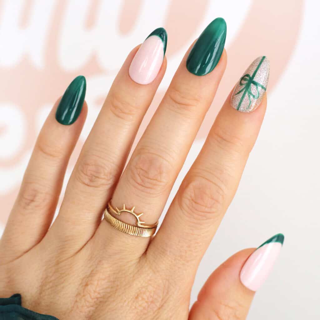 Deep Green French Tip with Silver Bow Almonds Deep Green French Tip with Silver Bow Almonds β Christmas Nails 2026