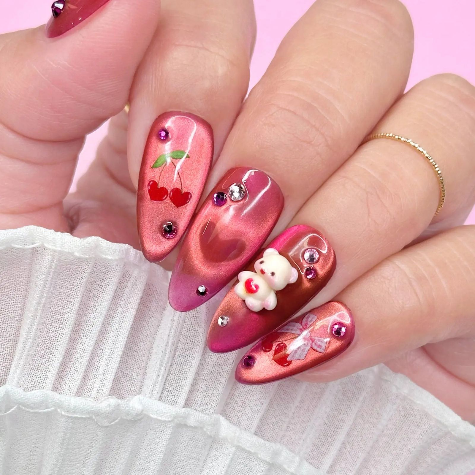 Pink and Red Cat-Eye with Teddy Bear Charm Pink and Red Cat-Eye with Teddy Bear Charm β Coquette Winter Nails