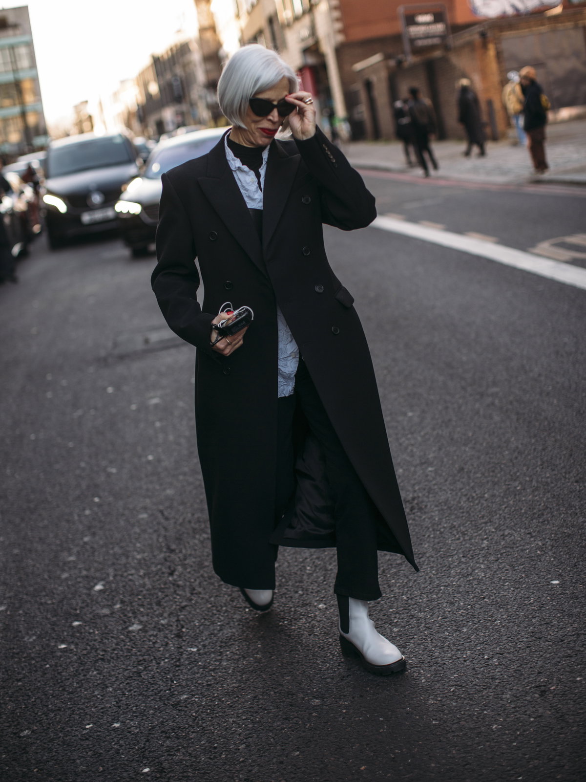 Urban Chic: White Boots with Black Trousers and Maxi Coat Urban Chic: White Boots with Black Trousers and Maxi Coat β Ankle Boots Outfits