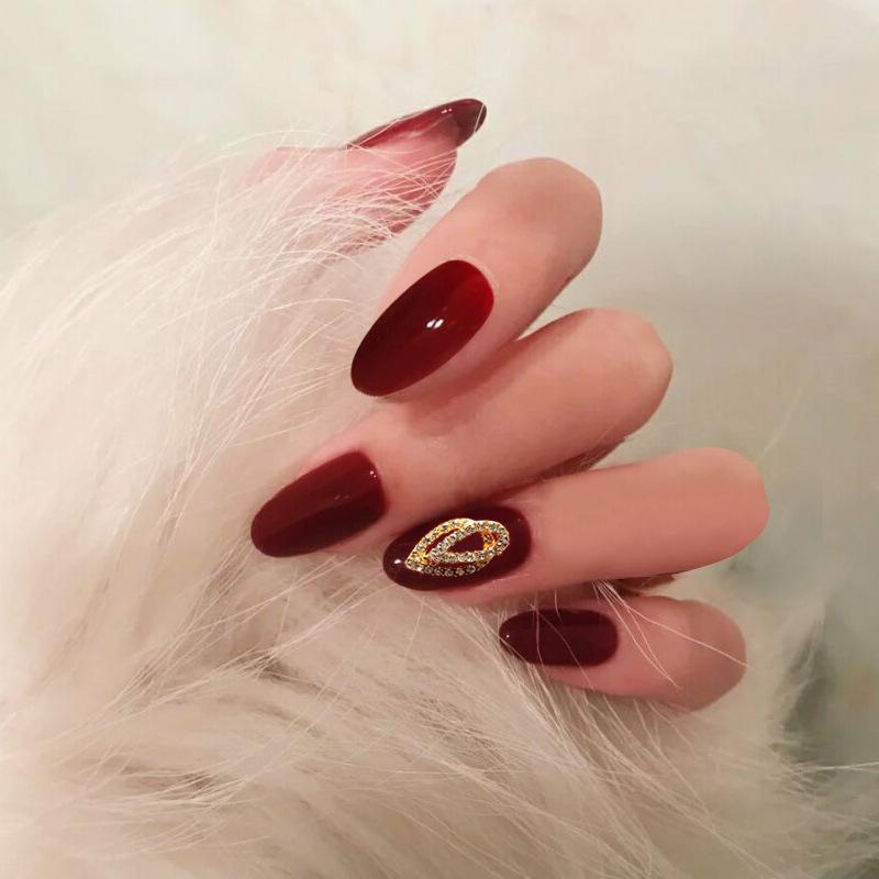 Medium Oval Burgundy Jelly with Rhinestone Charm Medium Oval Burgundy Jelly with Rhinestone Charm β Burgundy Christmas Nails 2026