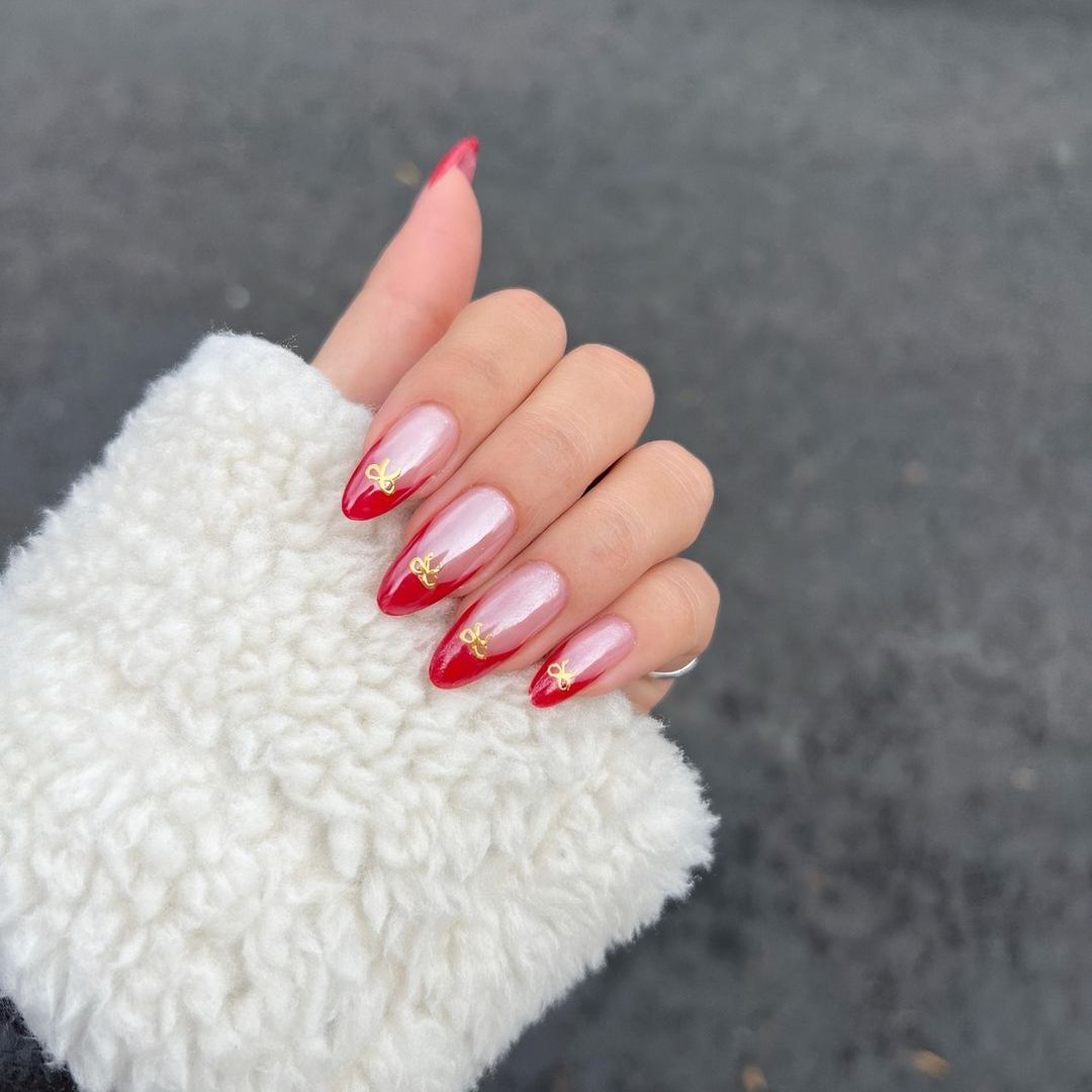 Shimmery Pinkish-White French with Gold Bows Shimmery Pinkish-White French with Gold Bows β Coquette Winter Nails
