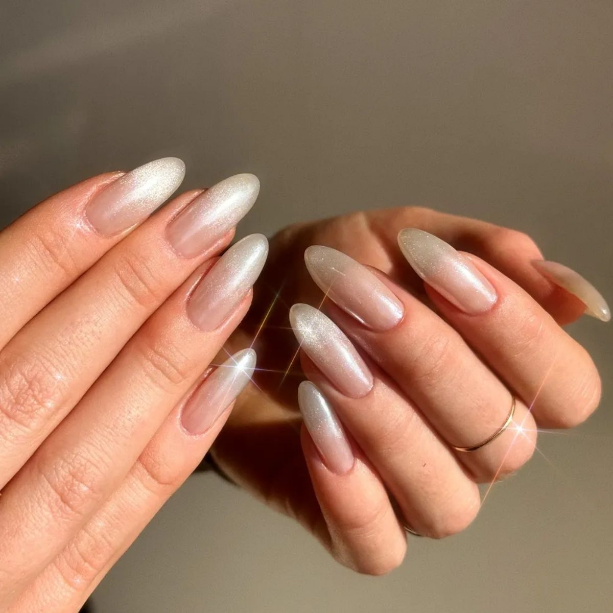 Sheer Nude Cat-Eye Shimmer Almonds Sheer Nude Cat-Eye Shimmer Almonds β Sparkly New Years Nails 2027