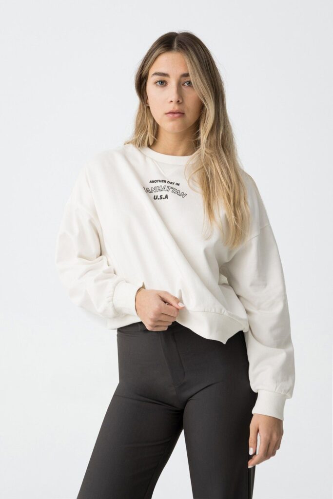 Graphic Sweatshirt with Dark Trousers — Winter School Outfits