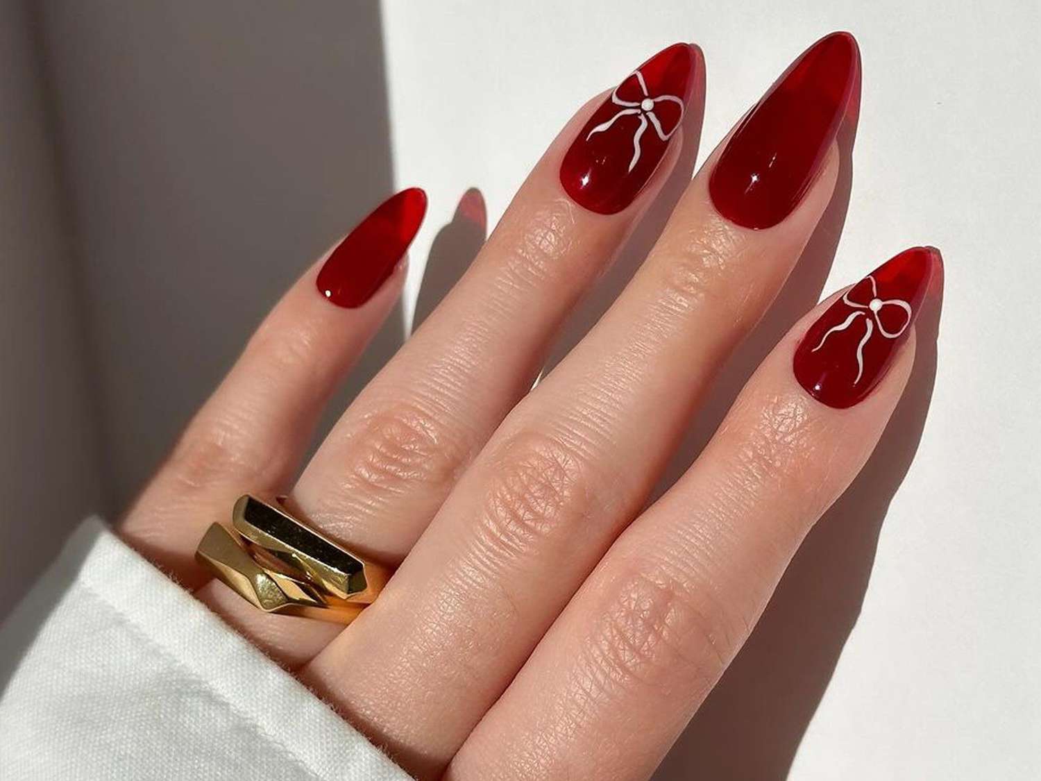 Translucent Red With White Bow Art Translucent Red With White Bow Art β Winter Nail Colors for Women Over 40