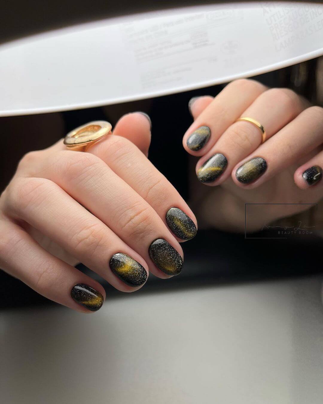Gold Shimmer Cat-Eye Charcoal Gold Shimmer Cat-Eye Charcoal β Winter Nail Colors for Brown Skin