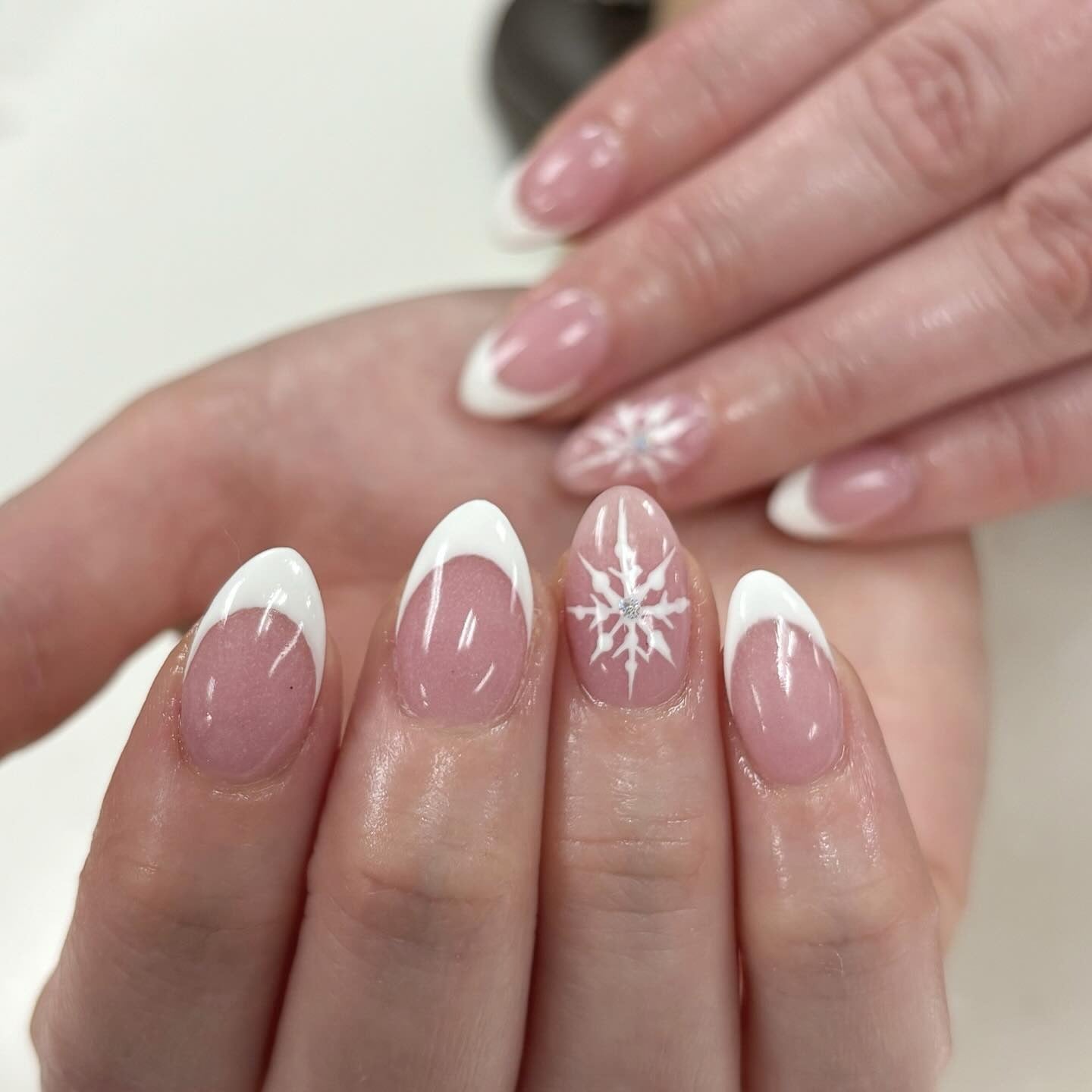 Snowflake Rhinestone French Tip Ovals Snowflake Rhinestone French Tip Ovals β Winter French Tip Nails