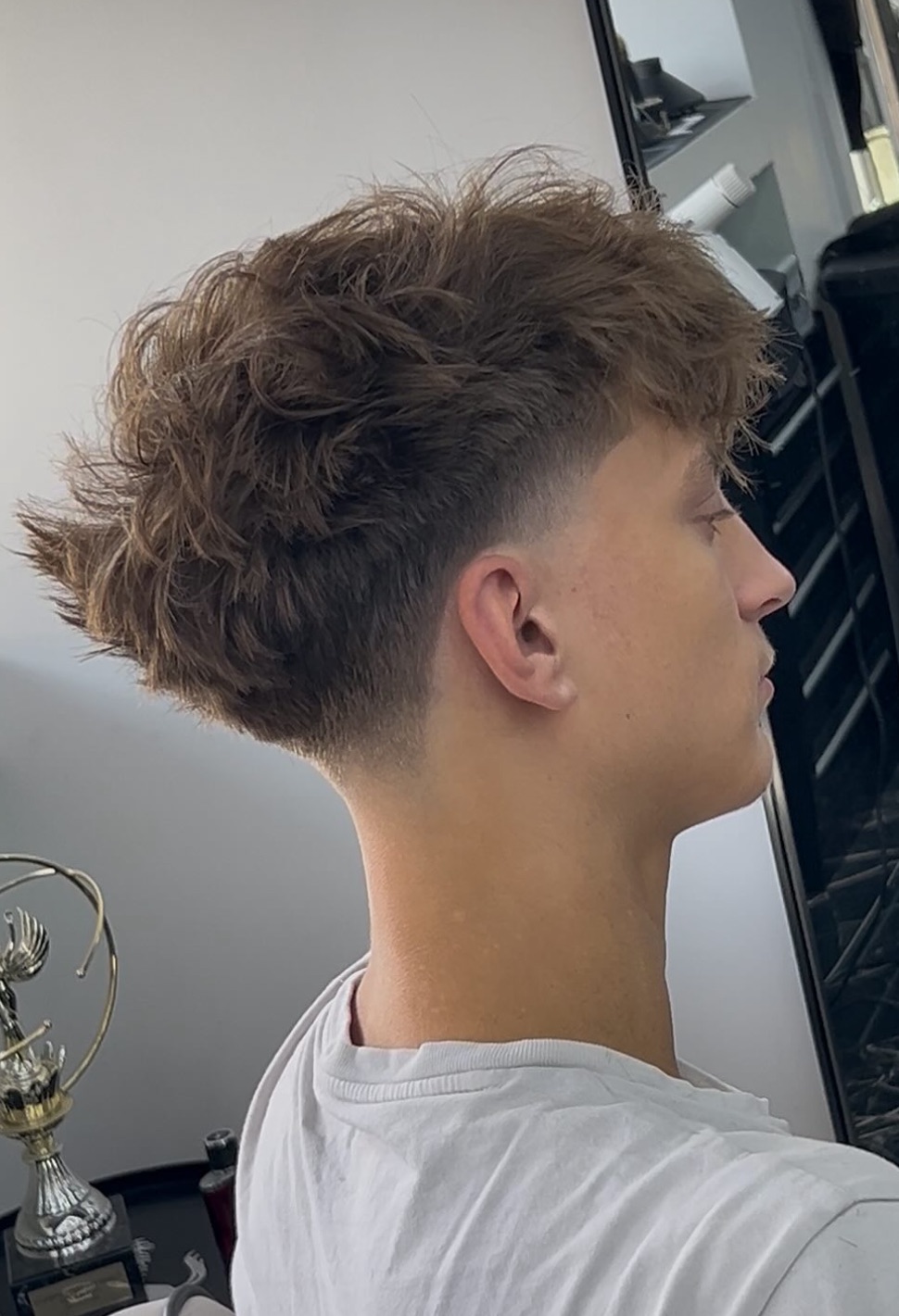 Light Brown Taper Fade With Textured Top — Winter Hairstyles for Men