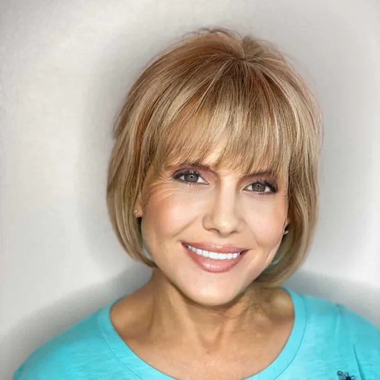 Classic Warm Blonde Bob With Full Fringe — Winter Haircuts for Women Over 60