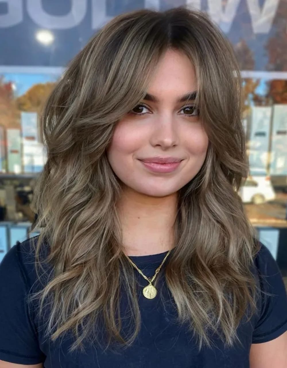 Collarbone Wavy Ash Blonde With Side Bangs — Winter Haircuts for Oval Faces